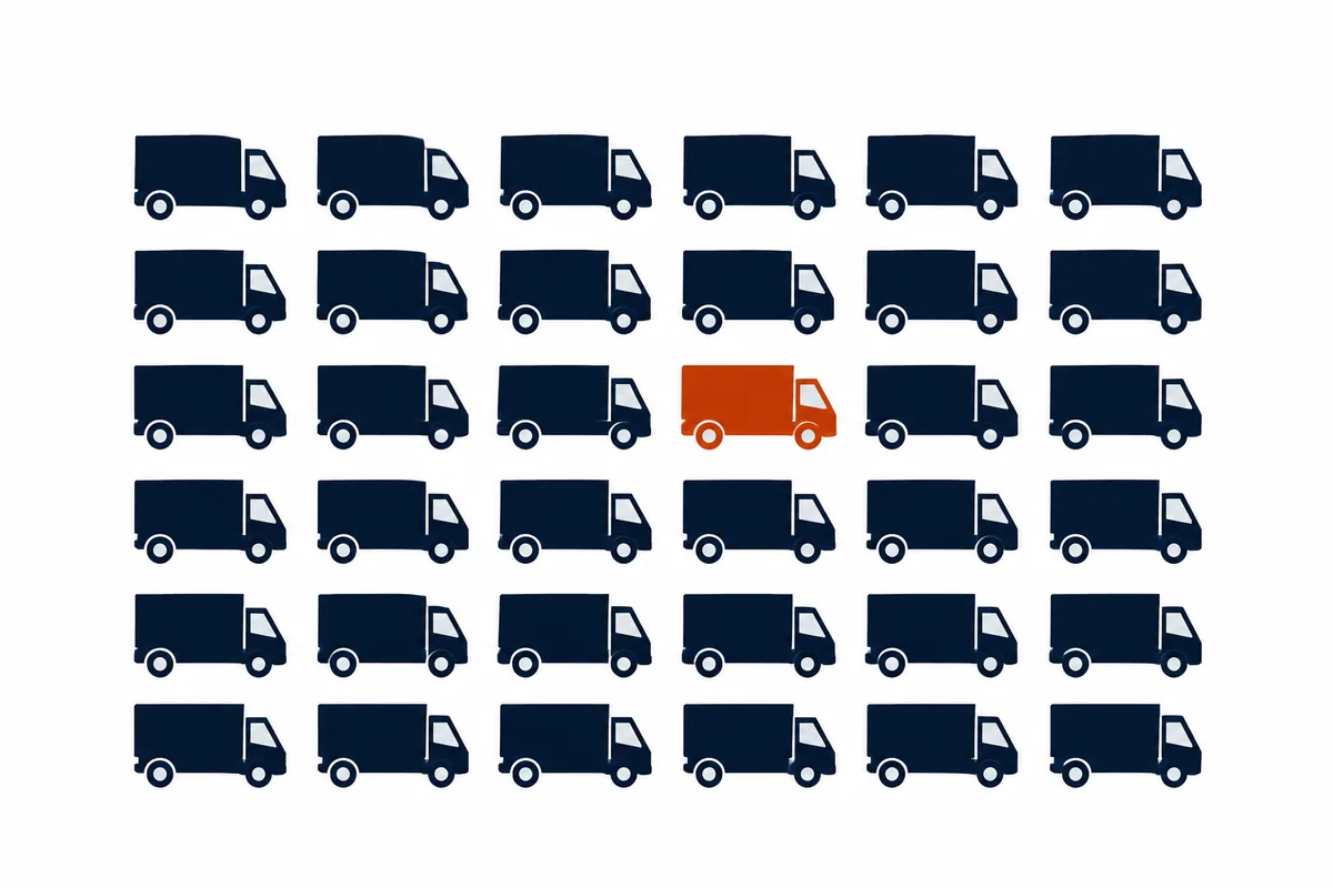 A dense grid of delivery trucks with a single one highlighted